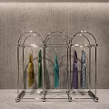 Modern Metal Clothes Rack With Multiple Hooks Holding Colorful Scarves And Garments