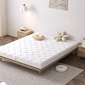 Cozy Bedroom Interior With White Quilted Mattress Wooden Bed Frame Nightstands And Flower Pillows
