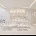 Modern Tea Room Interior With Wooden Shelves Tea Table Stools And Green Plants