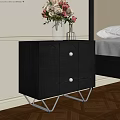 Black Wooden Nightstand With Round Panel Drawers Metal Legs In Modern Bedroom With Flower Vase