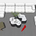 Modern White Sofa Set With Cloud Shaped Coffee Table Plants And Red Accent Decor
