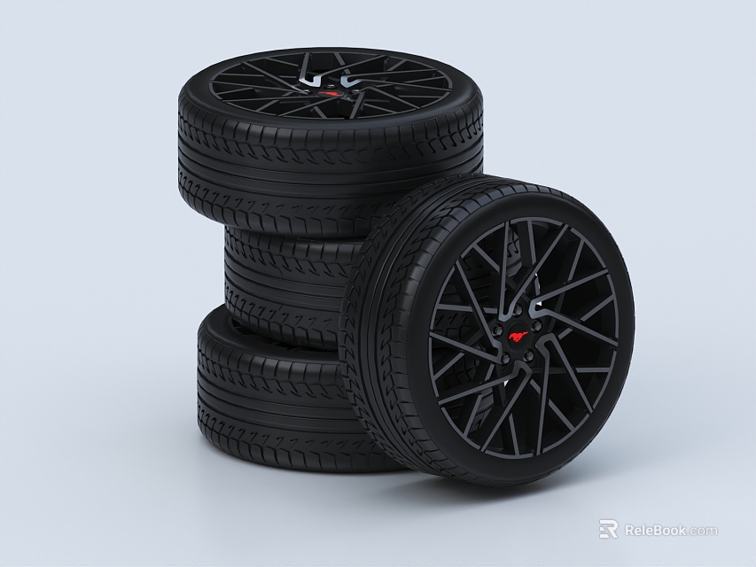 Black Car Tires Stacked With Stylish Wheels And Red Accents 3d model 