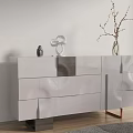 Modern White Sideboard with Glossy Finish Multiple Drawers and Decorative Vase Sculpture