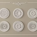 Six Intricate Carved Decorative Plates Arranged On Beige Background With Ornate Borders