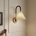 Elegant Wall Lamp With Gold Base Cream Shade And Black Curved Arm On White Wall