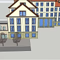 Traditional Commercial Street With Red Roof Buildings And Tree Lined Path