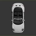 White Convertible Sports Car With Sleek Design And Black Top Alloy Wheels