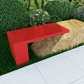 Red And Natural Stone Outdoor Bench In Garden With Green Plants And Grass