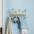 Modern Blue Wall Mounted Hook Organizer with Hanging Headphones Purse Towel and Colorful Beads