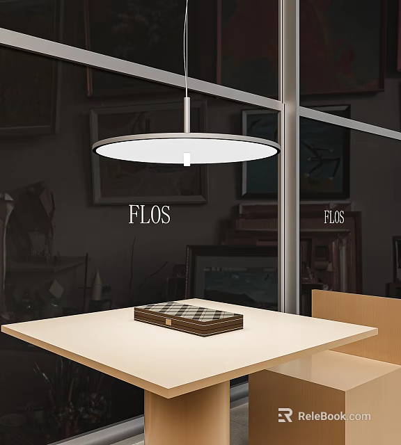 FLOS Round White Pendant Light Hanging Above Modern Table In Showroom Interior 3d model 