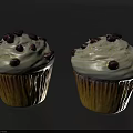 Delicious Cupcakes Topped With White Frosting And Chocolate Chips On A Reflective Dark Surface