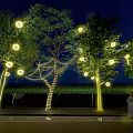 Garden Night Decor With Illuminated Trees And Hanging Round Lights