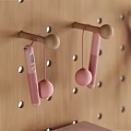 Sports Equipment Organized on Pegboard Wall With Dumbbells Resistance Bands Yoga Rollers And Jump Ropes