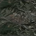 Natural Rugged Mountainous Terrain With Deep Gullies And Layered Soil Formations
