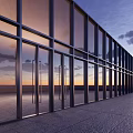 Contemporary Building Exterior Design With Glass Facade Metal Frames And Sunset Sky Reflection