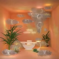 Commercial Luminous Bed Display With Orange Walls Cloud Shaped Decorations Plants White Table And Lamp