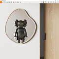 Heart Shaped Mirror Reflecting Black Doll With XX Eyes Against White Wall And Wooden Door