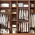 Organized Wooden Wardrobe Interior With Hanging Clothes Folded Clothes And Storage Baskets
