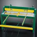 Green Frame Manual Metal Shear With Yellow Foot Pedal And Worktable