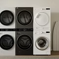 Modern Front Load Washing Machines in Black and White Stacked in Laundry Room