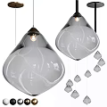 Two Oversized Glass Pendant Lamps With White Swirl Patterns And Hanging Small Decorative Pendants