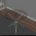 Round Transparent Glass Top Coffee Table With Metal Frame On Gray Rug And Sunlight Shadows