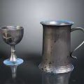 Intricate Carved Silver Chalice With Cross Pattern And Tankard Handle Detail