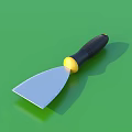 Household Putty Knife With Black Handle Yellow Connector And Silver Blade On Green Surface