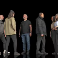 Group of People Standing Together With Diverse Clothing Against Black Background