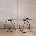 Two Modern Coffee Tables with Metal Frame Glass Top and Decorative Items on Wooden Floor