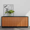Modern Wooden Decorative Cabinet With Vertical Stripes Green Plant In Vase And Abstract Painting
