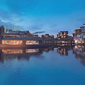 Scenic Evening Commercial Landscape With Modern Buildings Waterfront And Illuminated Reflections