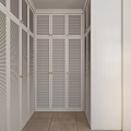 Spacious Walk In Closet With White Louvered Doors And Scenic Window View