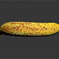 Ripe Yellow Banana with Brown Spots and Stem on Black Background with Reflection