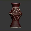 Red Decorative Vase With White Geometric Patterns And Ornate Design Details
