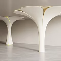 Modern Sculptural Tables With White Petal Shaped Bases And Gold Accents