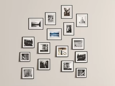 Gallery Style Photo Wall Featuring Black and White Photos in Various Size Frames 3d model