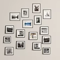 Gallery Style Photo Wall Featuring Black and White Photos in Various Size Frames