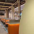 Modern Restaurant Interior With Golden Lines Red Bar Counter Booths And City View Windows