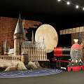 Harry Potter Themed Photo Spot With Castle Train Moon And Flags On Brick Wall