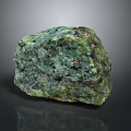 Natural Green And Black Raw Stone With Rough Surface And Mineral Texture