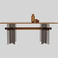 Modern Dining Table With Wooden Top And Metal Legs Featuring Brown Bottle And Small Cups