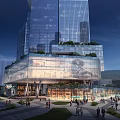 Modern Commercial Complex With Tall Glass Facades And Illuminated Night View