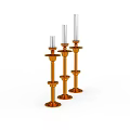 Three Orange Decorative Candle Holders With White Candles On White Background