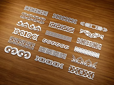 Various Decorative Carvings Displayed on Wooden Background with Intricate Patterns 3d model