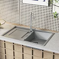 Modern Kitchen Sink With Faucet On Granite Countertop Near Fruit Bowl And Perforated Wall
