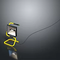 Yellow Portable Work Light With Adjustable Stand And Black Cable On Dark Surface