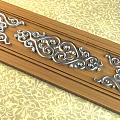 Intricate Silver Decorative Carvings On Wooden Panel With Curly Patterns 3d model
