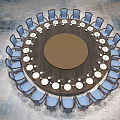 Round Dining Table Set With Blue Chairs And Arranged White Dinnerware 3d model