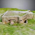 Ancient Stone Fortress Ruin With Grass Covered Top In Green Grassland Area